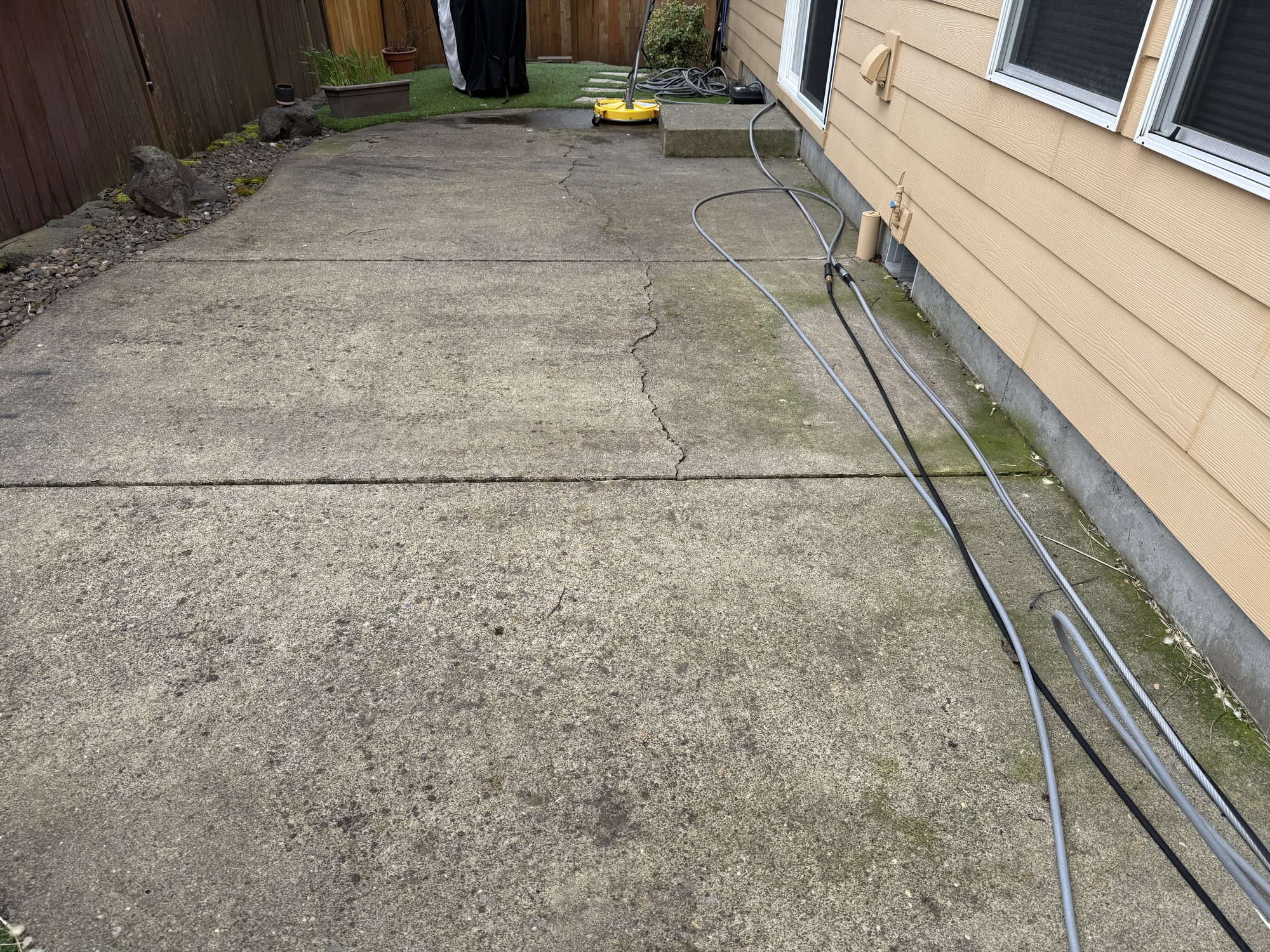 Before: stained driveway