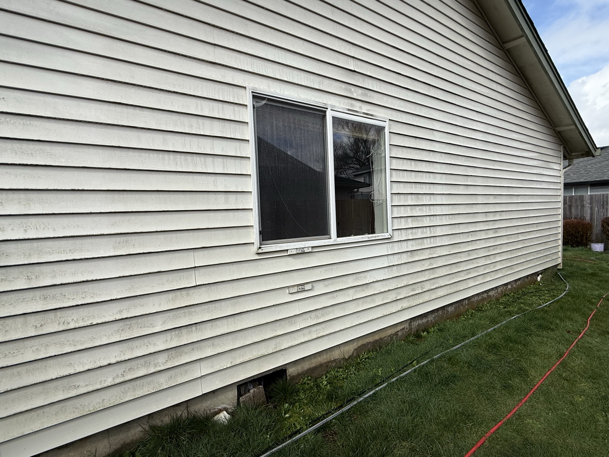 Before: dirty siding